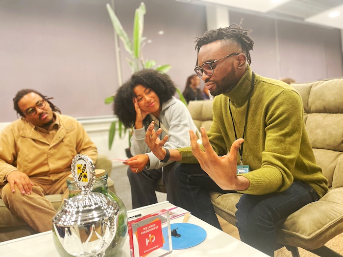 Black people take part in a discussion at an event for Black professionals