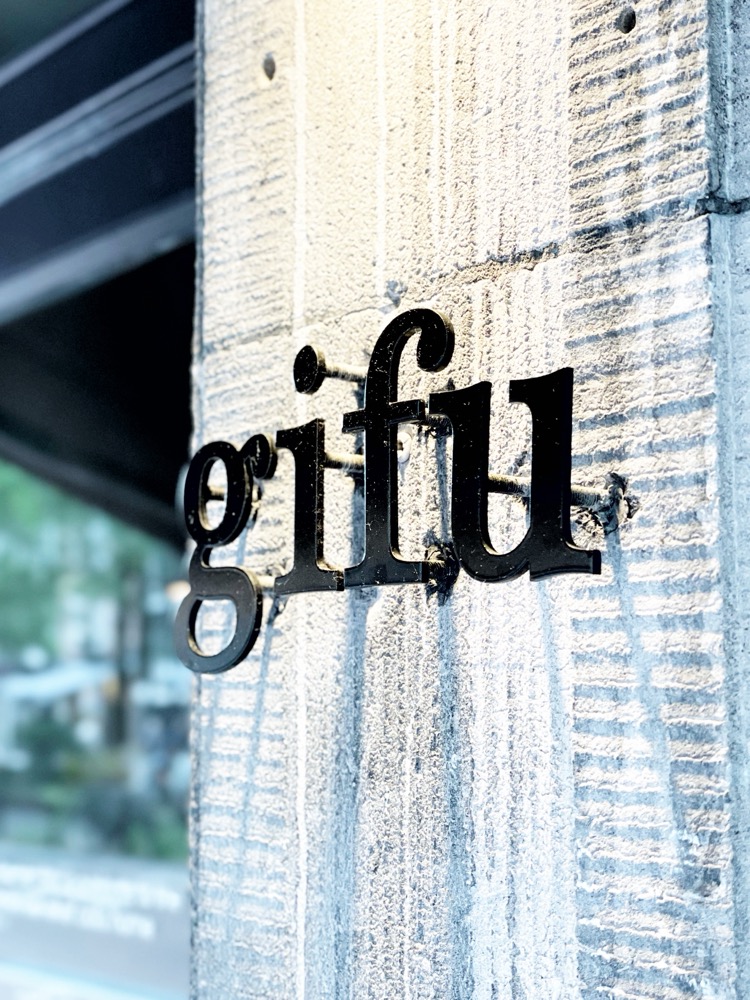 Logo for ramen restaurant Gifu on the venue's concrete wall